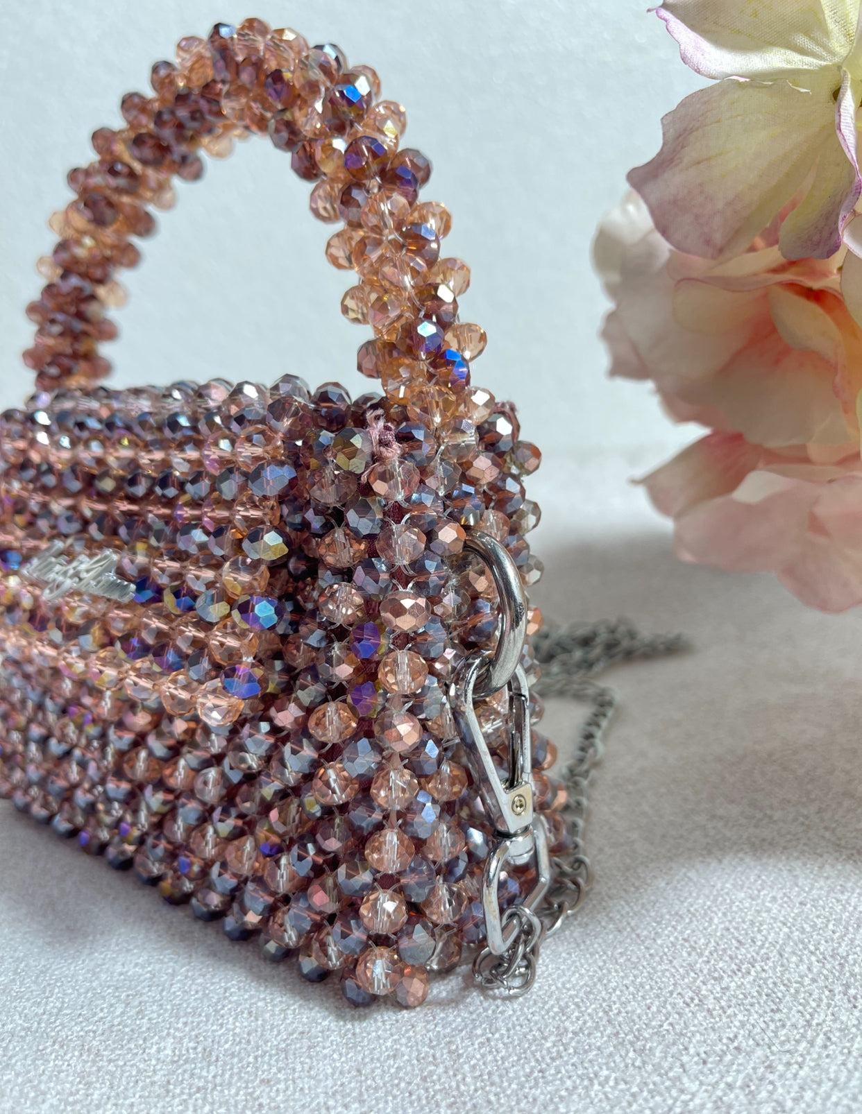 Sparkling handbag with crystal detailing on a light background